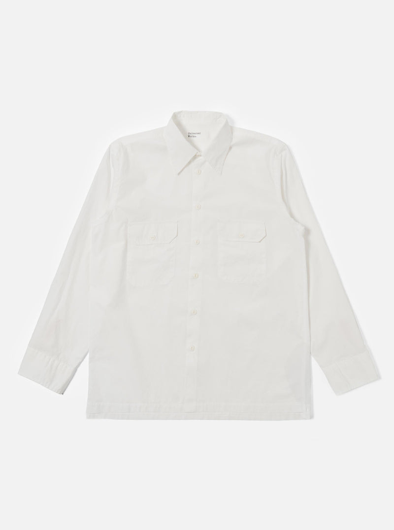 The Ecru Organic Fine Poplin CPO Shirt is shown as a flat lay against a plain white background. The shirt features a relaxed fit, a two-piece collar, a straight hem, and two large buttoned patch pockets on the chest. The organic cotton fabric is a solid ecru color with a smooth poplin weave.