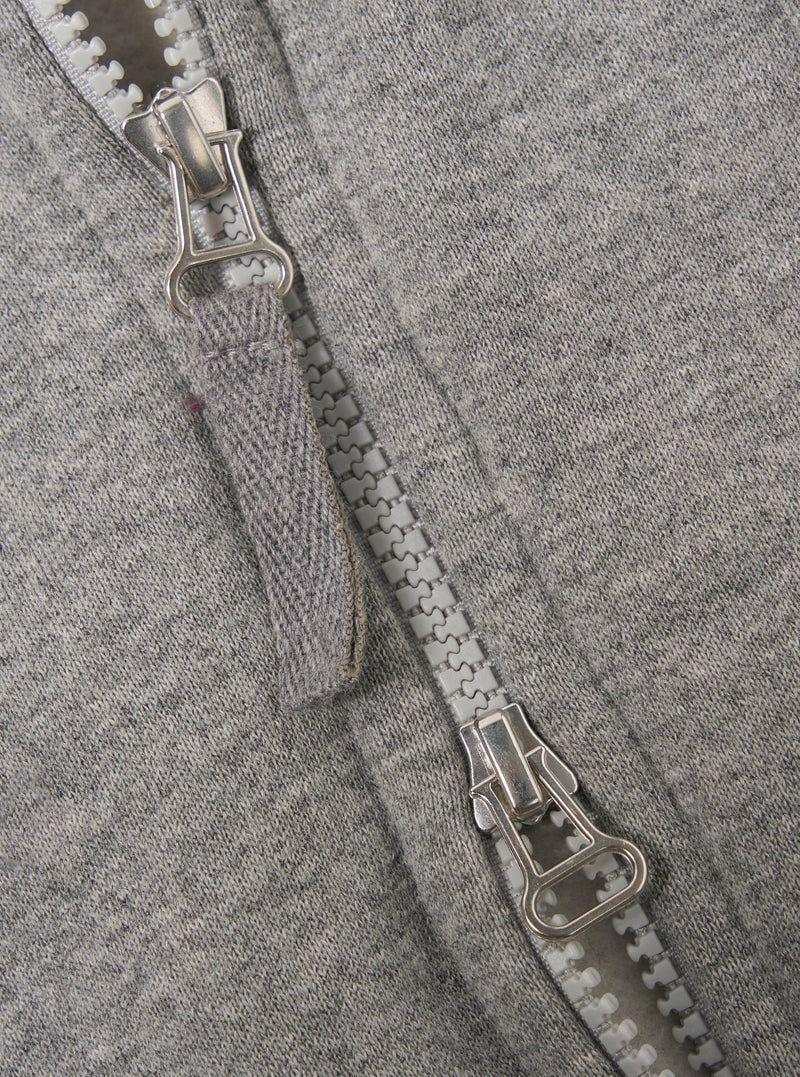 The Grey Marl Recycled Cotton Blend Jersey Tyler Jacket is shown from the back as a flat lay against a plain white background. The image highlights the jacket's simple rear construction, the soft grey marl texture of the recycled cotton blend fabric, and the ribbed hem and cuffs.