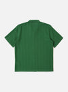 The Green Letts Cotton Road Shirt is shown from the back as a flat lay against a plain white background. The image highlights the short sleeves, a straight hem, and the clean construction of the back panel, showcasing the textured green Letts cotton fabric.