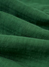 A close-up fabric swatch of the Green Letts Cotton Road Shirt highlights the olive green color and the fine, textured weave of the cotton material.