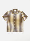 The Olive Aberdeen Lincot Road Shirt is shown as a flat lay against a plain white background. The shirt features a camp collar, a six-button front closure, and two large patch pockets at the waist. The garment is made from a blended cotton and linen fabric in a solid olive green color.