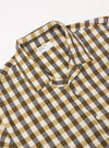 The Olive Aberdeen Lincot Road Shirt is shown from the back as a flat lay against a plain white background. The image highlights the shirt's construction, featuring a straight back yoke with a central box pleat and short sleeves. The fabric is a textured olive green cotton-linen blend with visible stitching.