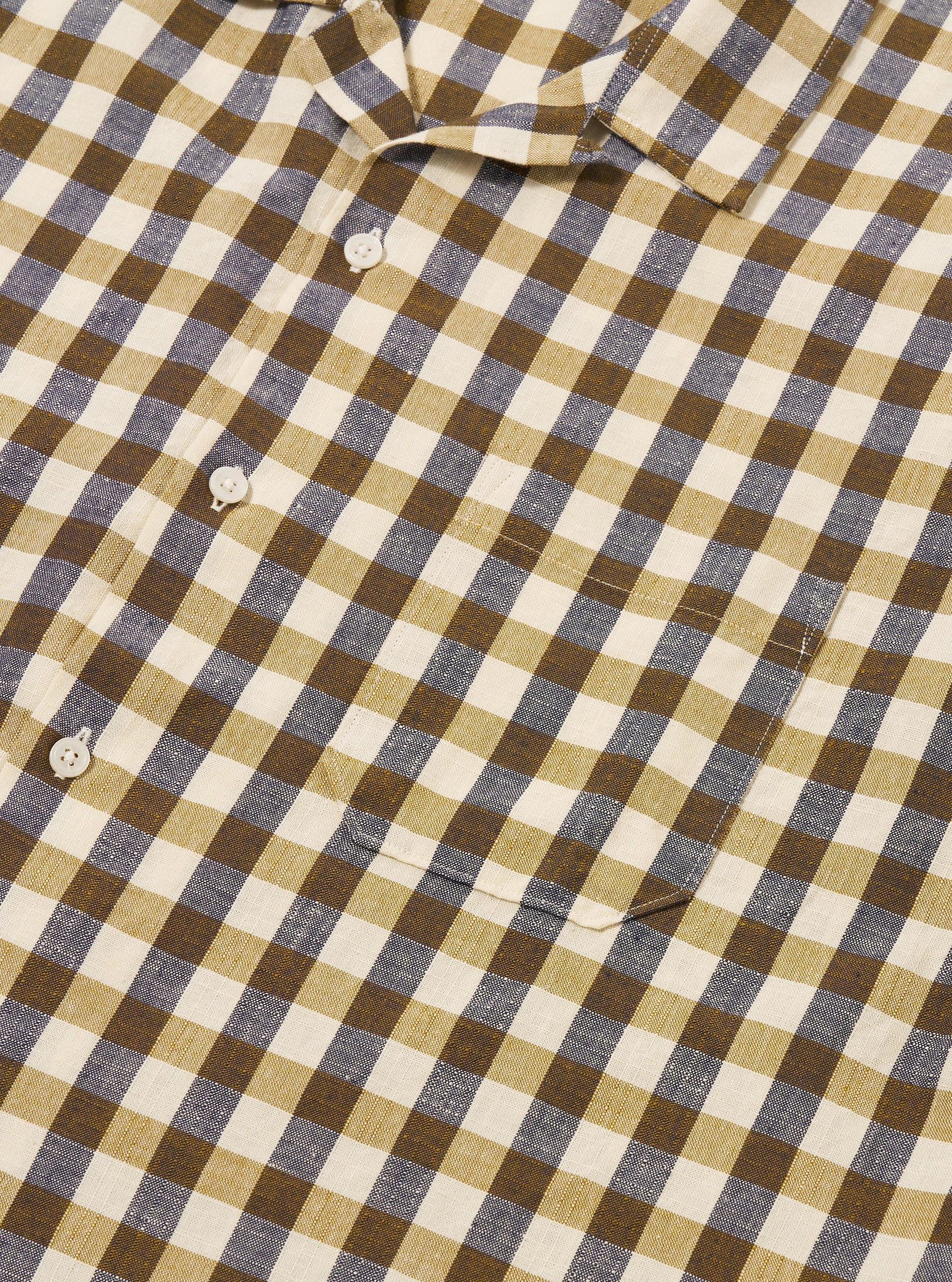 The Olive Aberdeen Lincot Road Shirt is shown from the back as a flat lay against a plain white background. The image highlights the shirt's straight hem, short sleeves, and the textured olive green cotton-linen blend fabric.