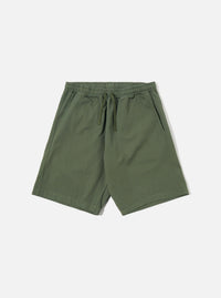 The Olive Kelly Cotton Simple Short is shown as a flat lay against a plain white background. The shorts feature an elasticated waistband with a matching olive green drawstring and two side pockets. The fabric is a solid olive green cotton with a smooth, matte finish.