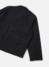 Rear detail flat lay of the black brushed moleskin Franck jacket on a plain white studio surface. The smooth, matte fabric has a subtle nap. Visible details include the back panel, a collar visible at the top, a set-in sleeve with a side seam, and a straight hemline.