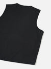 Black brushed moleskin gilet laid flat on a light grey surface, shot from above at a slight angle. The back of the garment is shown, revealing a crew neckline with topstitching, curved armholes with clean-finished edges, and a plain, unbroken back panel in smooth black fabric.