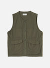 Olive brushed moleskin gilet laid flat on a light grey studio backdrop. V-neckline with a Universal Works woven label at the back neck. Four-button placket down the centre front. Two chest patch pockets and two larger flap patch pockets at the lower front. Sleeveless with armhole binding and a straight hem. Visible topstitching throughout.