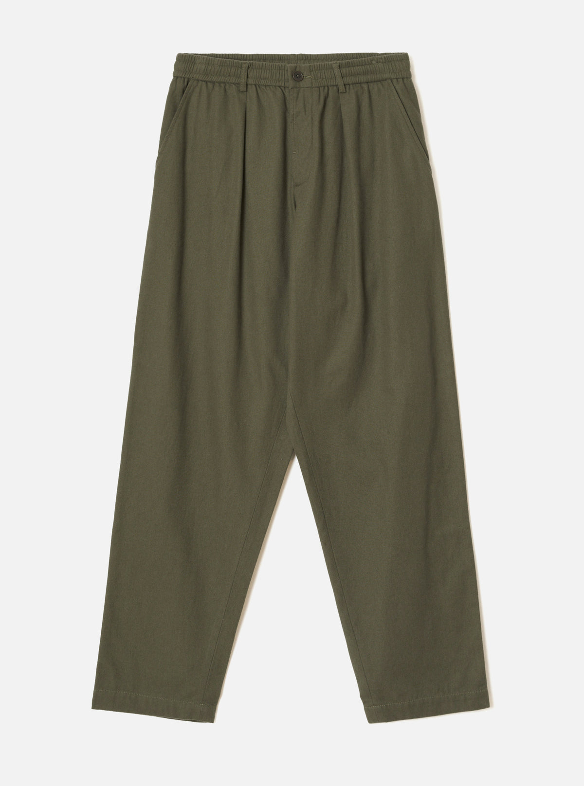 Olive brushed moleskin pleated track pants laid flat on a plain light grey studio backdrop. The elasticated waistband features a single dark button at the centre front. Pleats run from waist to thigh on each leg, with slanted side pockets. The wide leg tapers slightly toward the cropped hem.