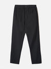 Black brushed moleskin military chinos laid flat on a light grey studio backdrop. The waistband features belt loops and a single dark button fastening at the centre front. Slant side pockets sit at the hips. The fabric has a subtle brushed texture. The trousers taper slightly from a relaxed thigh to a narrower ankle hem.