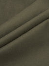 Close-up of olive brushed moleskin fabric, showing a soft, fine-textured surface with a subtle matte finish. The cloth is folded to reveal two raised ridges, highlighting the fabric weight and smooth hand-feel. The solid khaki-green tone is consistent throughout, with no pattern or sheen visible.