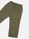 Flat lay of olive brushed moleskin hi-water trousers on a white studio backdrop, shot from the rear at an angle. The elasticated waistband is visible at the top, with two large patch pockets on the back. The plain, lightly textured fabric has a soft matte finish. The cropped leg hem is visible at the bottom.