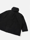 Black Mowbray Boston Parka laid flat on a white studio surface, showing the back. Smooth black fabric with curved seam detailing. A rolled hood sits at the collar. One sleeve is visible with a dark button at the cuff. Straight hem with a central back seam and slight drape.