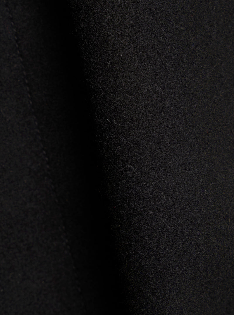 Close-up of the black Mowbray Boston Parka fabric, showing a soft, brushed wool-blend texture with fine surface fibres. The material has a dense, slightly napped finish in a deep black tone. No garment details or construction features are visible in this tight fabric shot.