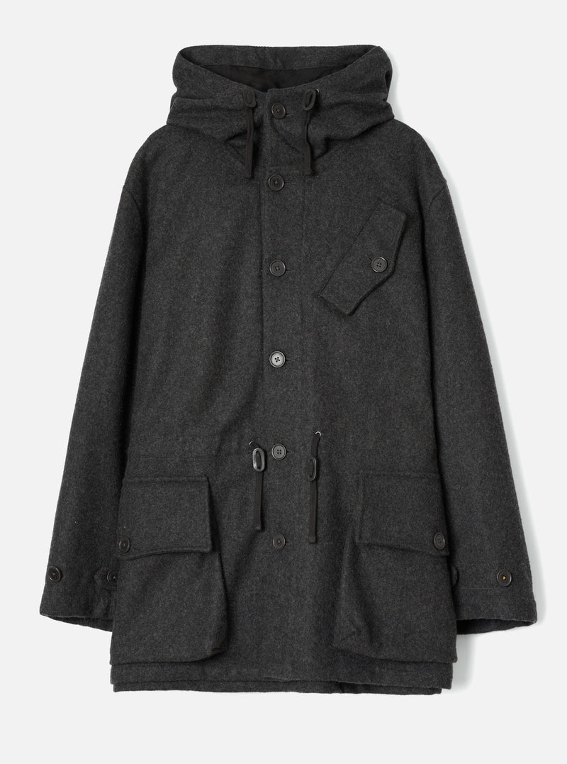 Grey marl wool-texture Mowbray Boston Parka laid flat on a light grey seamless backdrop. Features a large drawcord hood, single-breasted button placket, one chest patch pocket with button, a waist drawcord with toggle, two lower flap patch pockets, and buttoned cuffs.