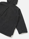 Close-up flat lay of the grey marl Mowbray Boston Parka on a white studio surface, showing the back panel and one sleeve. A hood with a drawcord is visible at the top. The cuff features a single dark button. Panelled seam detail runs along the sleeve. The wool-blend fabric has a fine marl texture throughout.
