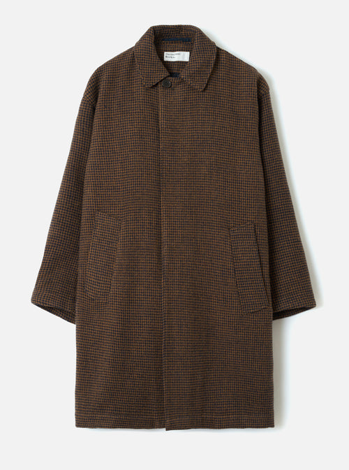 A studio front view of the Navy/Brown Wool Tweed Mix Stan Coat displayed against a plain background. The long coat features a structured collar, full button closure, side slit pockets, and rich dark blue and brown patterned wool tweed.