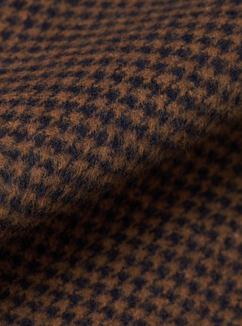 A close-up fabric swatch shot of the Navy/Brown Wool Tweed Mix Franck Jacket presented on a white backdrop. The macro image displays the intricate weave pattern, depth of color, and soft wool tweed texture.
