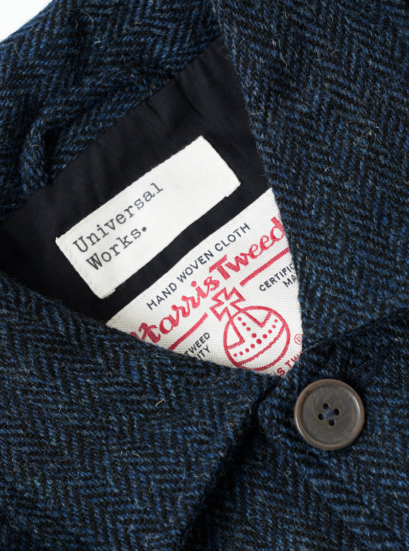 A close-up view showing the interior details and fabric weave of the Blue/Black Harris Tweed OG Bakers Chore Jacket against a plain background, focusing on the lining, inner pocket, and brand label.
