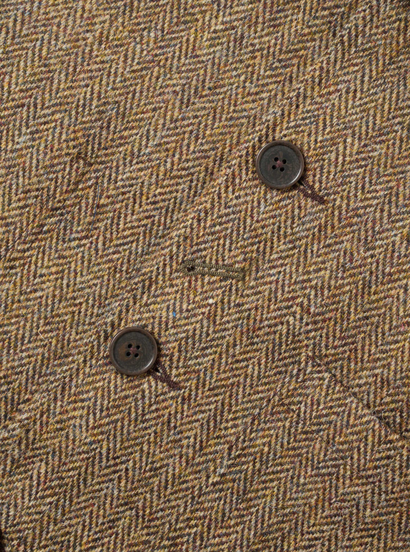Detailed close-up image of the Sand/Brown Harris Tweed OG Bakers Chore Jacket against a plain background, highlighting the button placket, collar stitching, and rich texture of the woven tweed material.