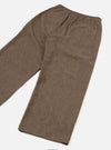 Brown wool herringbone Gillespie trousers laid flat on a white studio surface, angled diagonally. The herringbone weave is clearly visible across the fabric. An elasticated waistband sits at the top with a patch pocket on the rear right. The straight-leg cut tapers slightly to an unfinished hem.