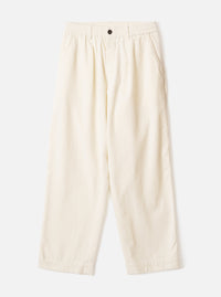 Ecru wide-leg velvet oxford trousers laid flat on a light grey background. The elasticated waistband features a single dark button at the centre front. Slash pockets sit at the hips. The fabric has a soft, fine-ribbed velvet texture. The silhouette is relaxed through the leg with a full-length hem.