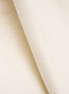 Close-up detail shot of the ecru velvet fabric used in the CPH Velvet Oxford Pant. The soft, dense pile is visible across the folded edge, showing the plush texture and subtle nap of the cream-toned velvet against a plain white studio backdrop.