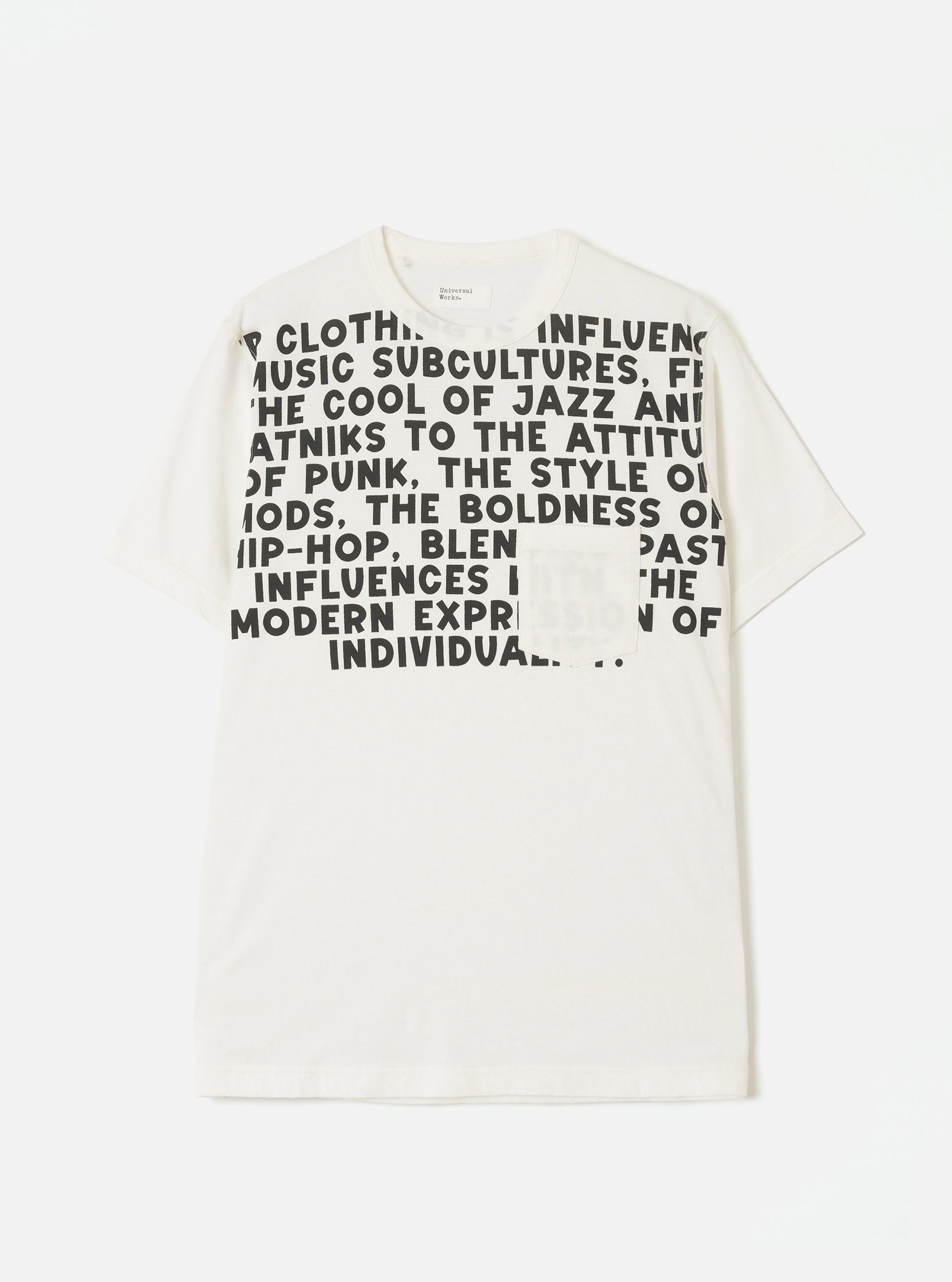 Ecru single jersey pocket tee laid flat on a light grey seamless backdrop. A bold black all-caps text graphic covers the chest, referencing music subcultures including jazz, punk, mods and hip-hop. A small patch chest pocket sits within the graphic. Crew neck, short sleeves and a Universal Works neck label visible.