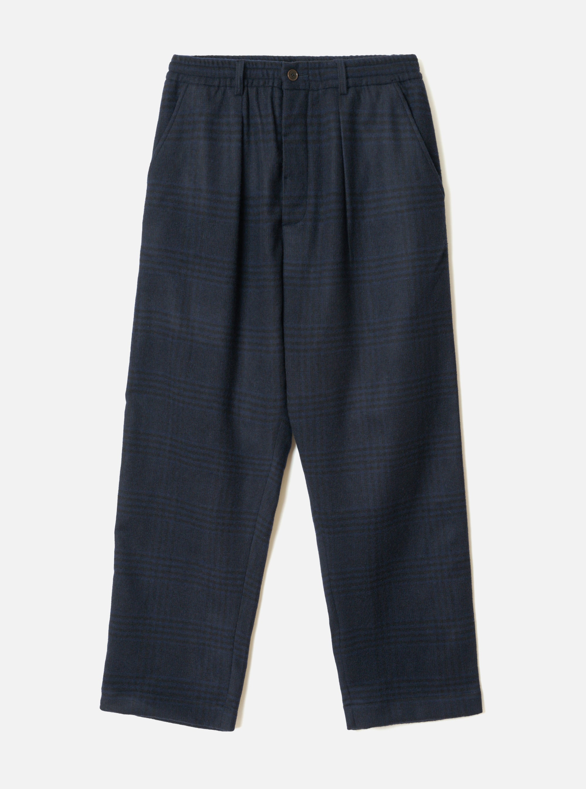 Navy wool mix oxford trousers in a tonal dark blue glen plaid. Elasticated waistband with a single metal button fastening at centre front, twin pleats, and slant side pockets. Wide straight leg with plain hem. Flat lay on a light grey seamless backdrop.