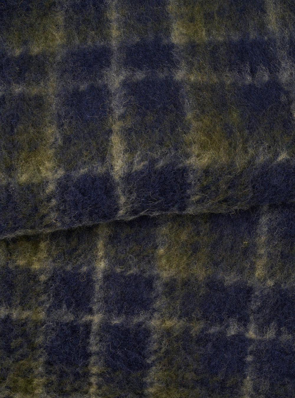 A close-up fabric swatch image of the Navy/Olive Check Daffy Fleece Mix Cardigan on a plain background, highlighting the soft brushed texture, navy and olive check pattern, and wool-blend weave.