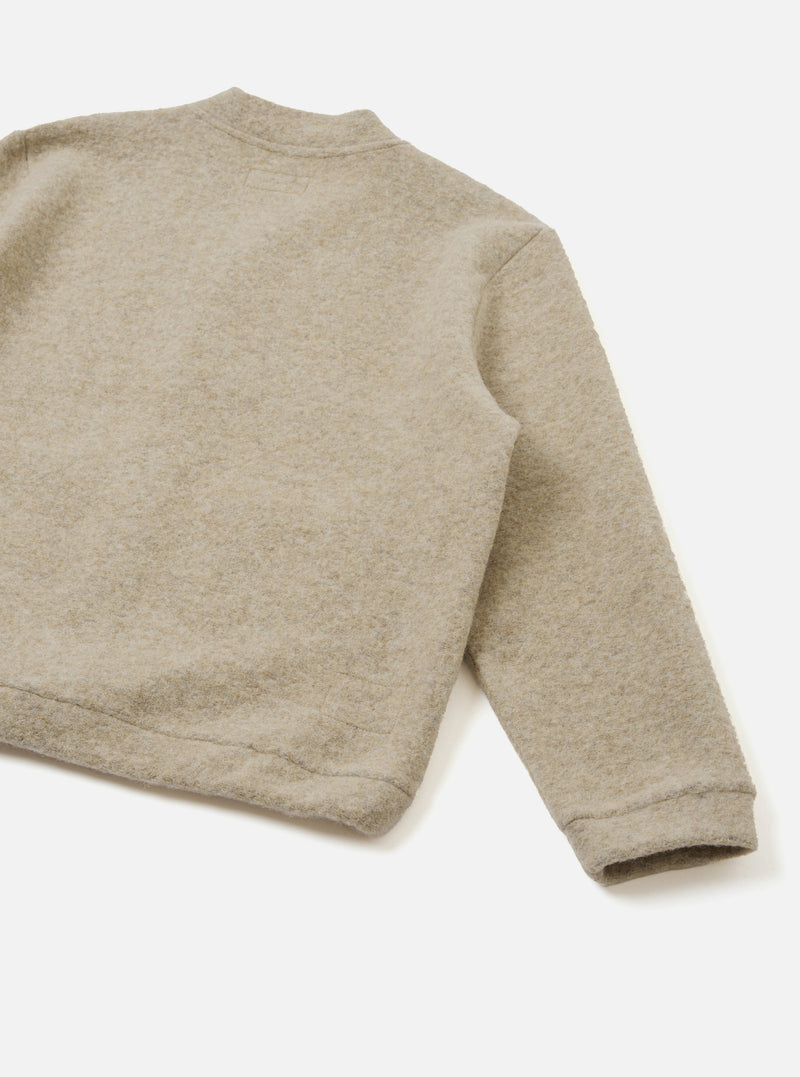 Rear view of the Fawn Wool Fleece Advance Cardigan displayed flat on a plain light background, showcasing the simple back panel design, soft fawn beige colour, and tactile wool fleece fabric texture.