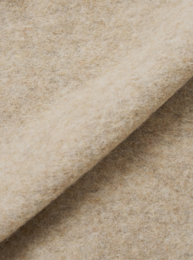 A close-up fabric swatch view of the Fawn Wool Fleece Advance Cardigan on a plain background, detailing the dense fleece surface, warm fawn beige hue, and high-quality wool-blend fabric texture.