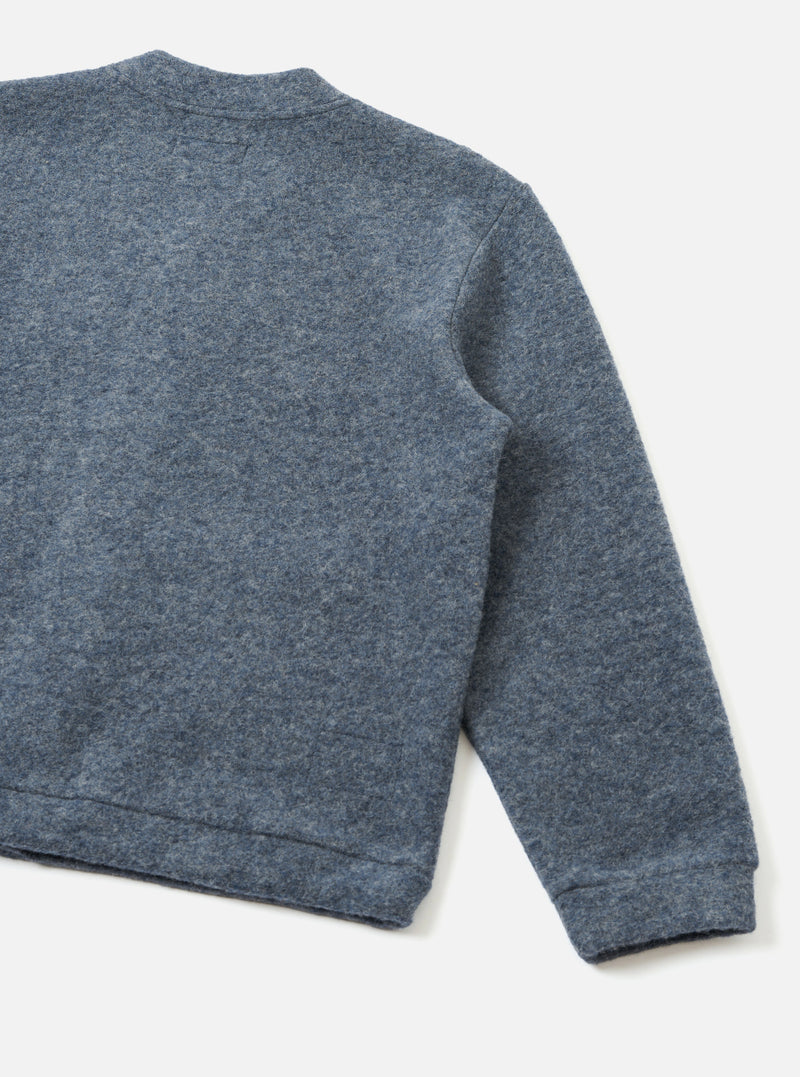 Rear view of the Slate Blue Wool Fleece Advance Cardigan laid flat on a plain light background, highlighting the solid back construction, relaxed boxy cut, and rich slate blue melange fleece fabric.