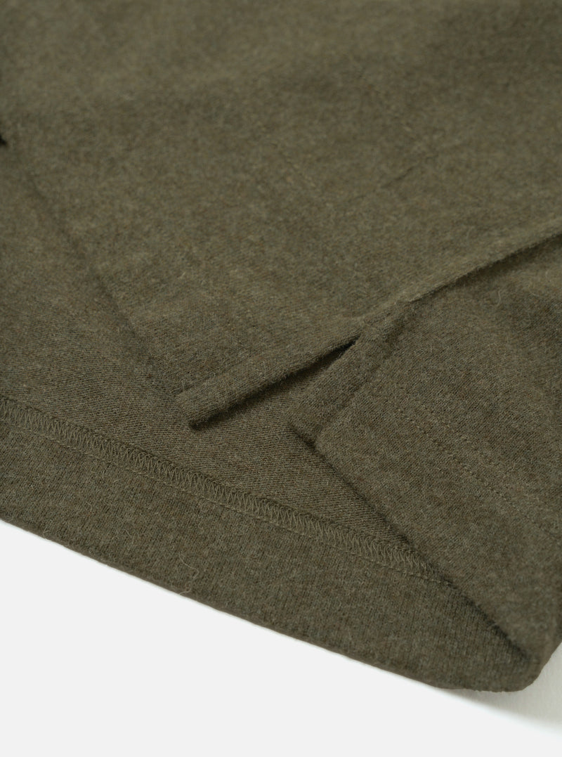 Detail view of the Olive Recycled Wool Mix SJ Pullover L/S Shirt on a plain background, showing the classic shirt collar, four-button closure, chest patch pocket, and textured olive jersey knit.