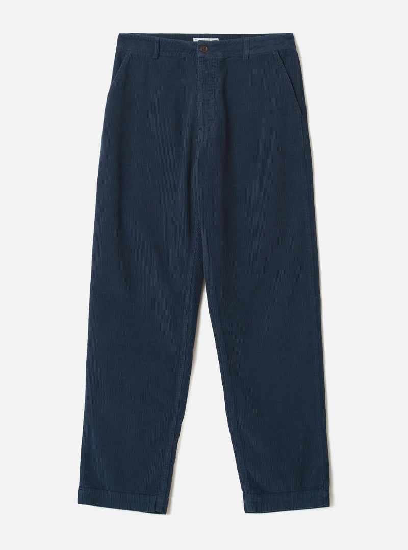 Dark navy corduroy military chino trousers laid flat on a light grey seamless backdrop. Wide-wale cord fabric with vertical ribbing throughout. Structured waistband with a single button fastening, belt loops, and slanted side pockets. Relaxed straight leg with a plain, unfinished hem.