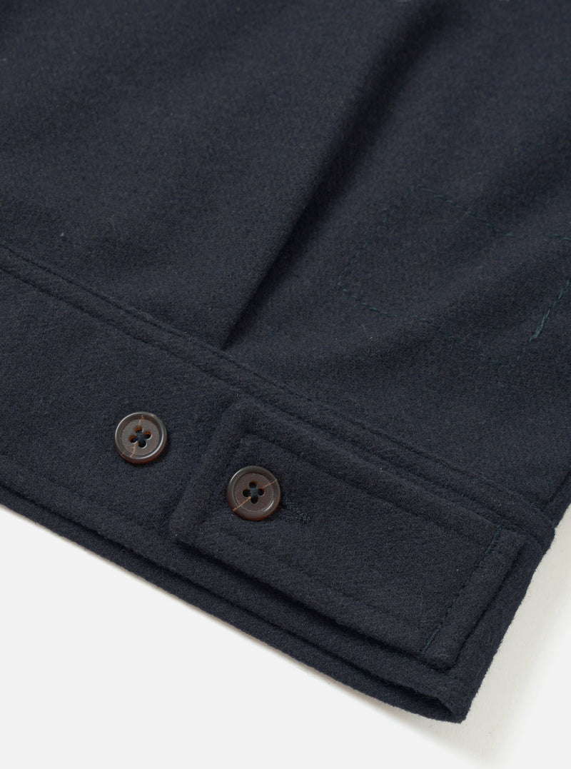 A detailed back view of the Dark Navy Dublin Wool Mix Rose Bowl Jacket set against a plain off-white background. The image highlights the clean rear hem, shoulder seam construction, and dark wool fabric texture.