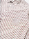 Close-up flat lay of a brown and white striped cotton shirt on a white background. The point collar, button placket with white buttons, and a chest patch pocket are visible. The pocket features a contrasting finer stripe panel. Topstitching outlines the pocket and placket seams.