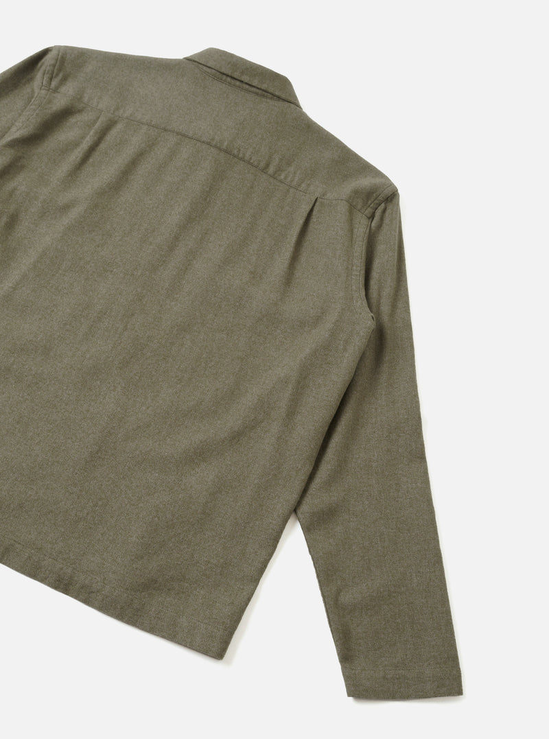 A clear back view of the Olive Monty Cotton Tencel Zip Shirt set against a plain white studio background, highlighting the smooth back panel, shoulder seams, and straight hem construction.
