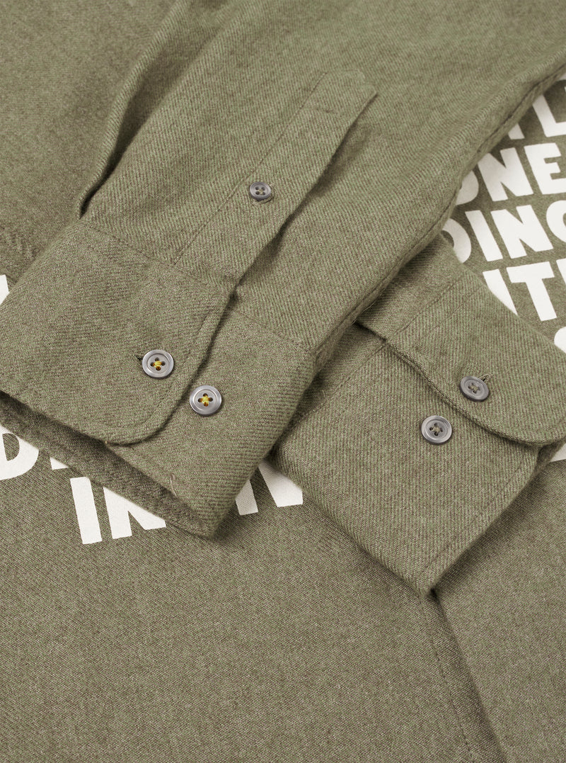 A detailed close-up shot of the collar and button placket on the Olive Monty Cotton Tencel Standard Shirt, set against a plain studio background to show fine stitching and buttons.