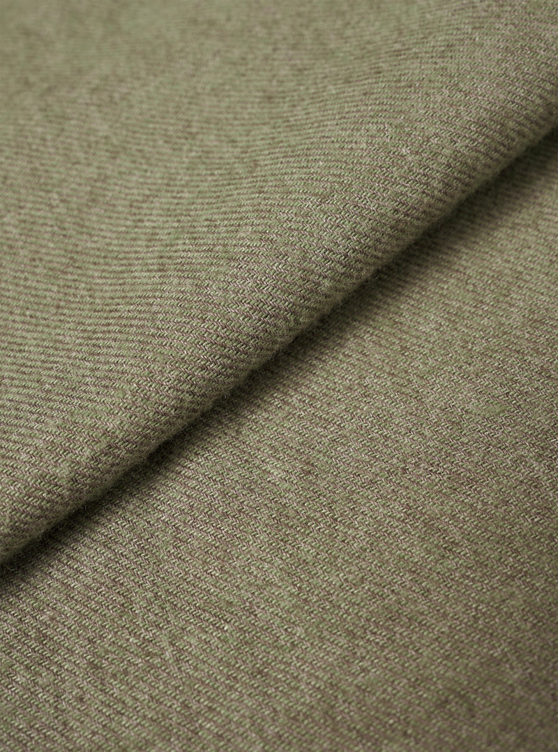 A detailed fabric swatch image filling the entire frame to demonstrate the woven texture and muted olive green hue of the fabric used for the Olive Monty Cotton Tencel Standard Shirt.