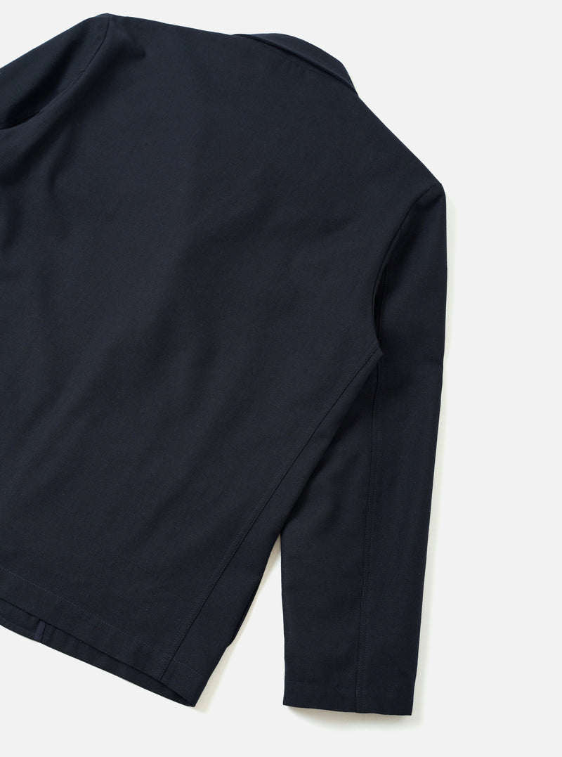 A back view of the Navy Recycled Italian Tweed Two Button Jacket presented against a neutral off-white background. The shot highlights the tailored back panel, fitted shoulders, and dark navy woven fabric structure.