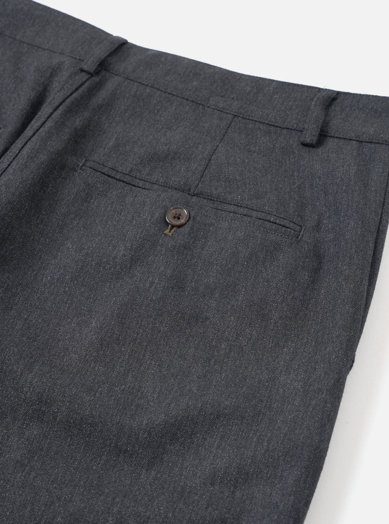 A close-up view of a model wearing the Charcoal Recycled Italian Tweed Military Chino, focusing on the waistband, belt loops, and side entry pocket. The shot emphasizes the rich grey tweed texture against a neutral background.