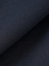 A detailed close-up fabric swatch photograph of the Navy Lucca Suiting Ives Jacket set against a plain white background, revealing the subtle weave pattern and fine texture of the navy cotton and acrylic fabric.