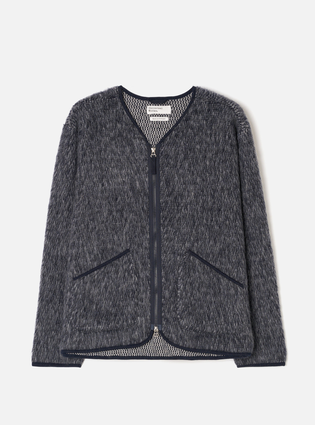 A full-length front view of a model wearing the Navy/Pale Grey Losso Mohair Mix Zip Liner Jacket in a bright studio backdrop. The shot showcases the zip front, collar, and patterned navy and grey mohair fabric.