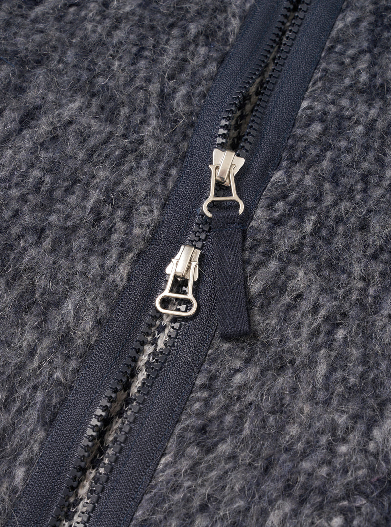 A close-up detail shot of a model wearing the Navy/Pale Grey Losso Mohair Mix Zip Liner Jacket, showing the zipper, neckline, and fuzzy texture of the navy and pale grey mohair blend fabric.