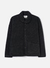 Charcoal boucle style fleece Lancaster jacket laid flat on a light grey studio backdrop. Features a shawl collar with black trim, five-button front placket, two large patch pockets, and a ribbed hem. The textured boucle style fabric has a looped, marl appearance throughout.