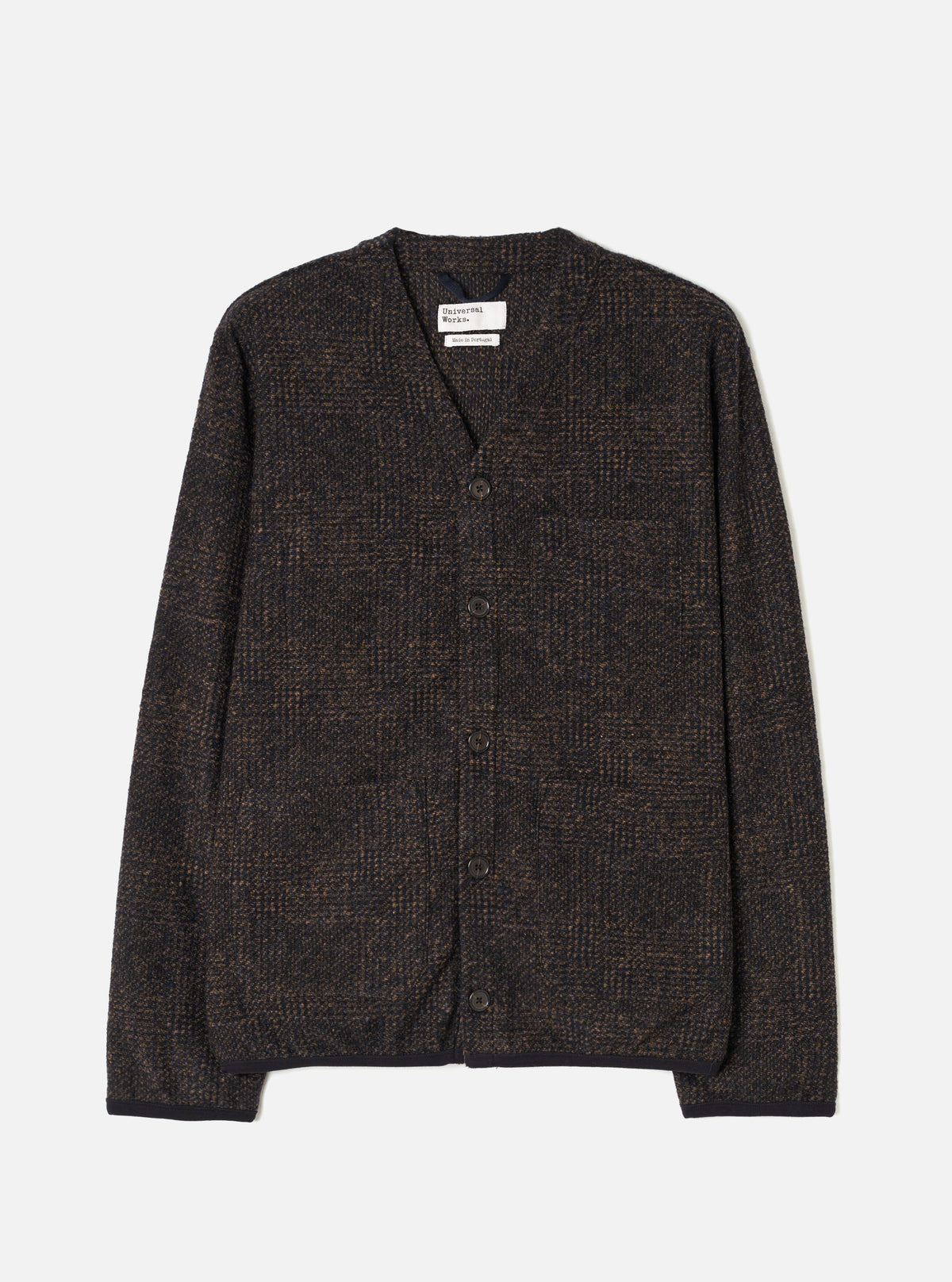 Full front product view of the Navy Deca Light Knit Cardigan displayed on a plain white background. The image showcases the V-neckline, button front fastening, ribbed cuffs, hem, and lightweight dark navy knit texture.