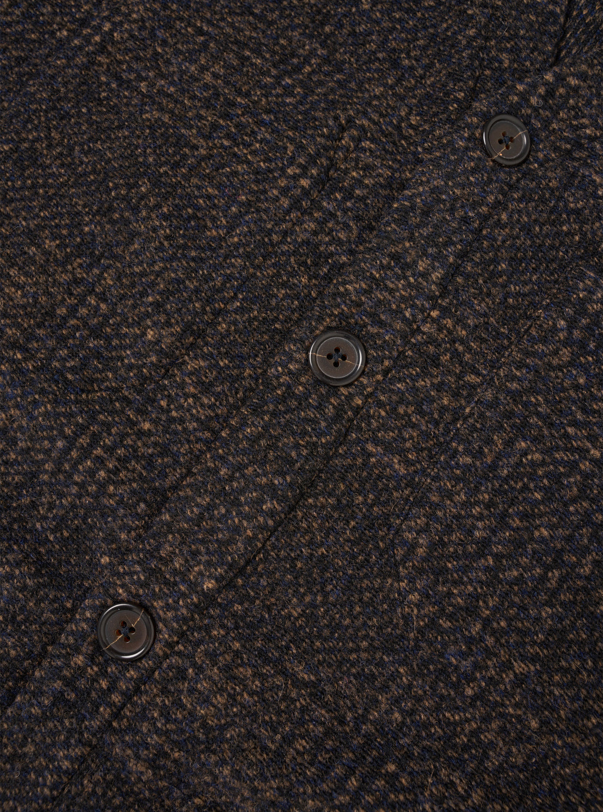 Detailed close-up photo of the Navy Deca Light Knit Cardigan on a plain white background, highlighting the front button placket, fine wool-blend knit structure, and subtle tonal stitching of the navy fabric.