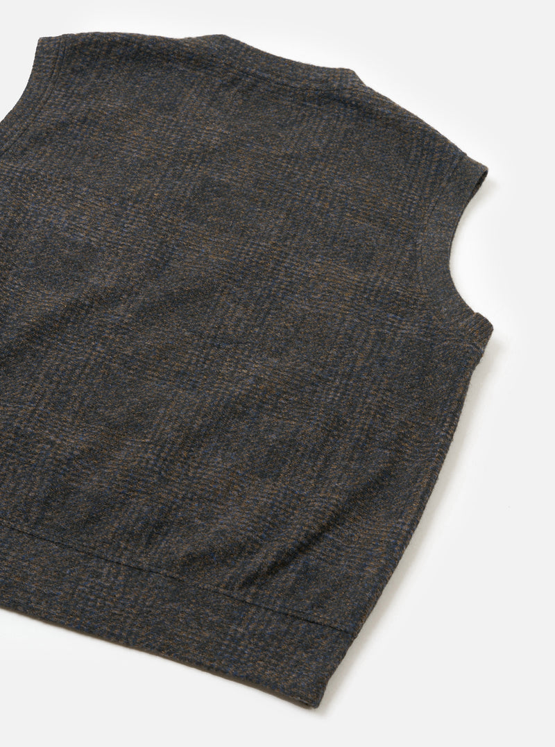 The Navy Deca Light Knit Sleeveless Crew is laid flat at an angle on a white surface, showing the back panel. Features include a wool-blend mottled Glen plaid check in navy, brown, and grey, wide armholes, and a straight ribbed hem.