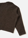 A back view of a model wearing the Brown Raven Fleece Rams Jacket against a plain studio background. The shot displays the dropped shoulder construction, straight hemline, and brown marl fleece texture.