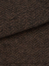 A close-up swatch image showing the textured brown marl wool fleece fabric of the Brown Raven Fleece Rams Jacket on a plain white background, highlighting the dense knit and warm marled color.